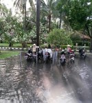 Bike park at the hotel after a rain storm. Thats one of our bikes under the plastic cover, the other beside.